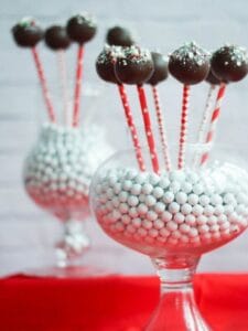 Chocolate Peppermint Cake Pops displayed in glass vases.