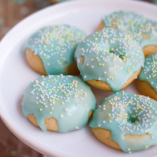 Italian Cookies decorated with pastel nonpareils on a plate.