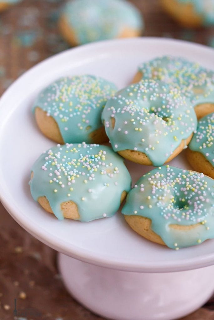Italian Cookies decorated with pastel nonpareils on a plate.