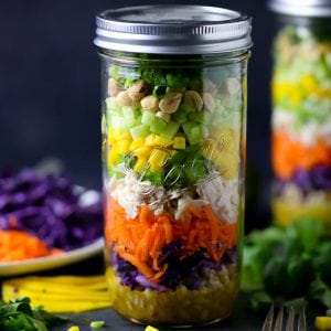 Thai Salad in a Jar layered with farro, veggies and chicken.