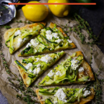 How bout crispy crust, melty cheese, and fresh zucchini grilled pizza for dinner tonight? No delivery required! Loaded with cheese, zucchini, lemon, fresh thyme, and a drizzle of garlic oil!