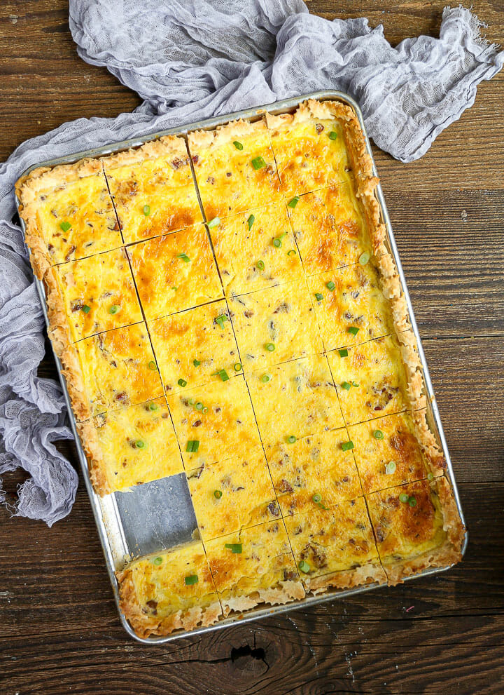 Sheet Pan Quiche Lorraine with one square removed.