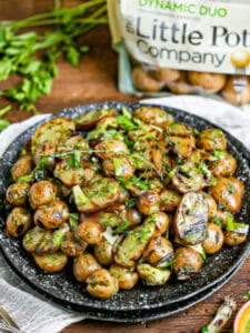 Grilled Potato Salad with a bag of potatoes in the background.