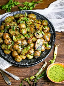Grilled Potato Salad with Herb Vinaigrette and grilled scallions on the side.