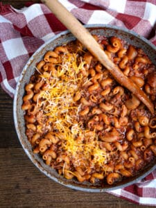Overhead shot of Classic American Goulash sprinkled with cheese.