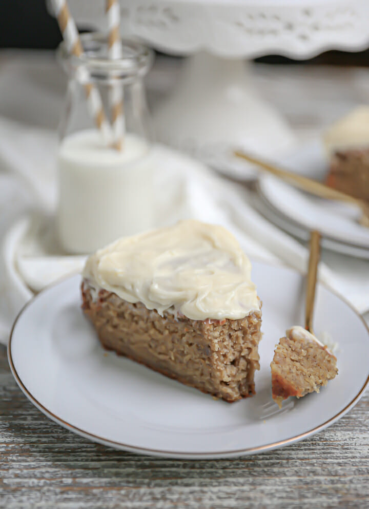 A slice of easy banana cake with a bite cut off.