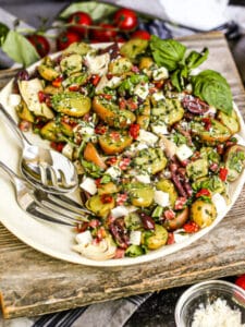 Italian Potato salad with a package of Little Potato Company Microwave potato kit on the table.