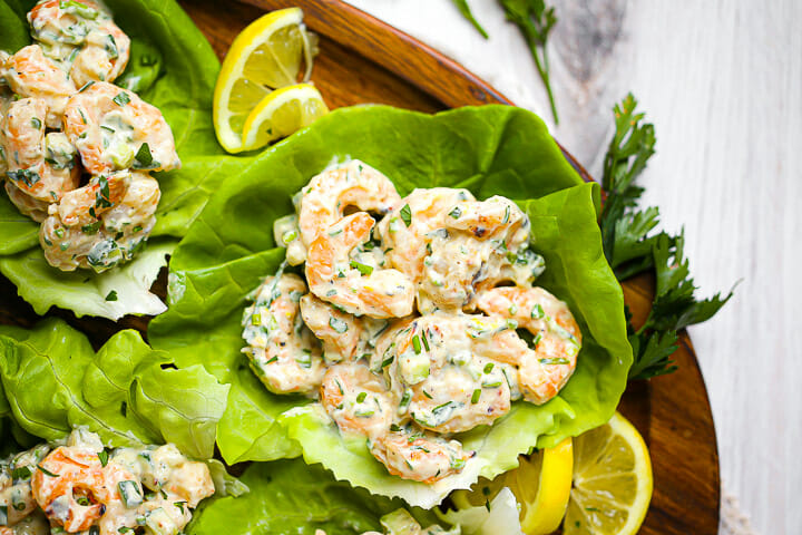 A serving of shrimp salad in a lettuce leaf.