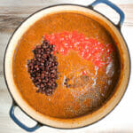 Pureed soup with beans, salsa and spices added.