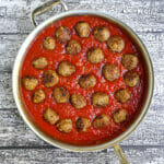 Tomato sauce with meatballs nestled in.