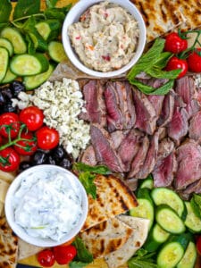 Lamb, veggies and dips arrange on a Mediterranean Mezze Platter