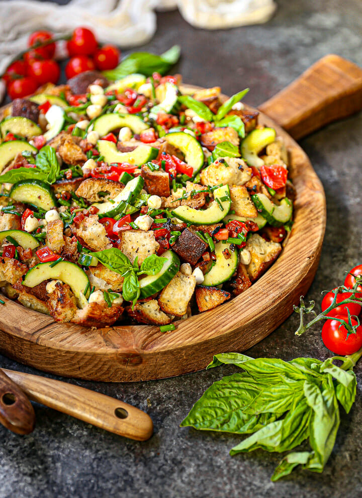 Dig into this garden fresh panzanella topped with fresh basil.