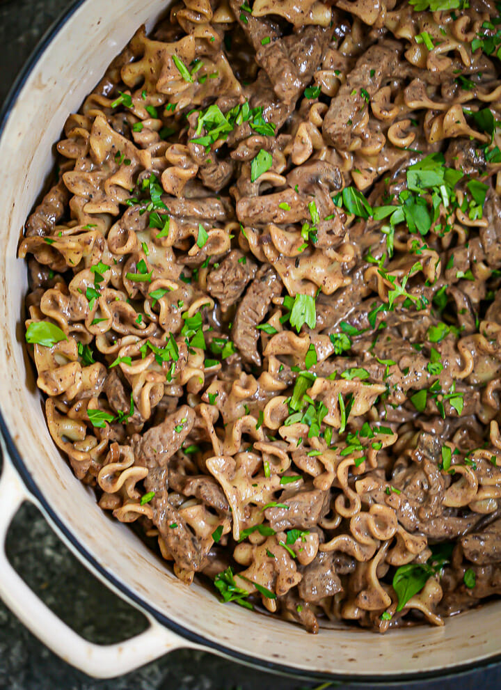 Overhead shot of Beef Stroganoff freshly cooked and sprinkled with parsley.