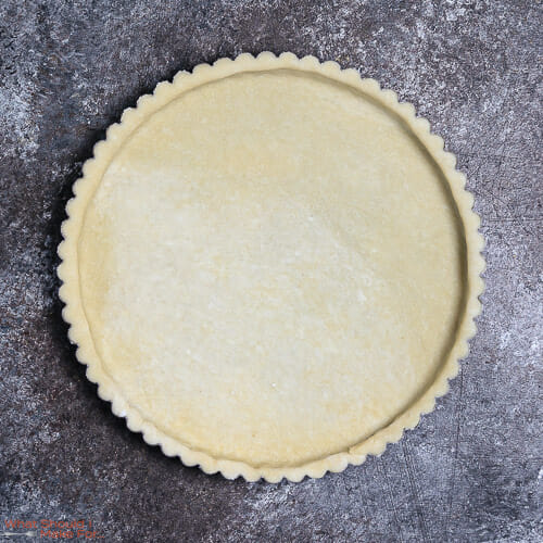 A buttery pie crust ready for baking.
