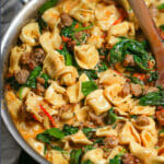 Quick and delicious, this one pot creamy sausage tortellini with spinach and tomatoes can be on your table in just 30 minutes!